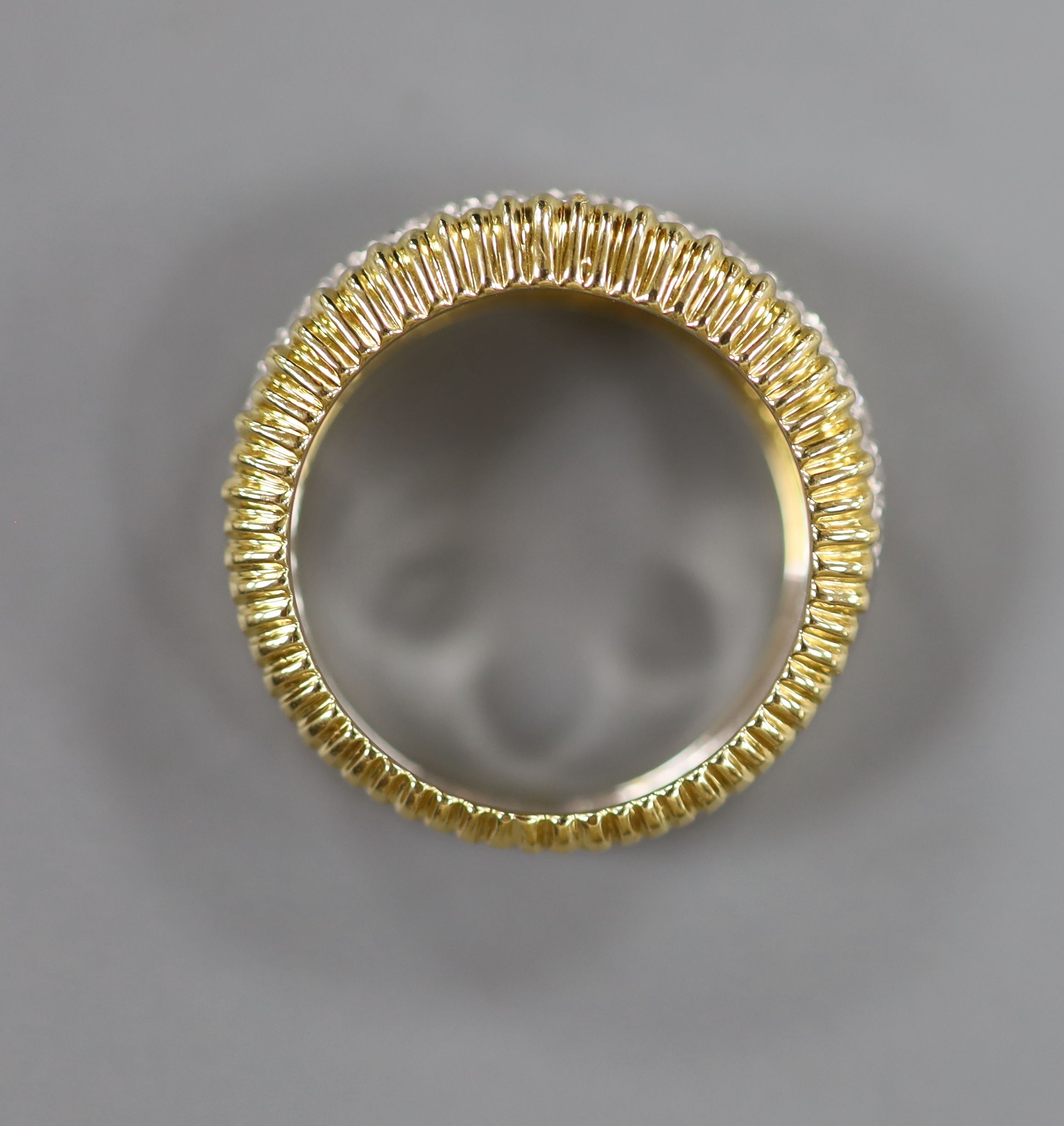 A modern 18ct gold and pave set diamond dress ring